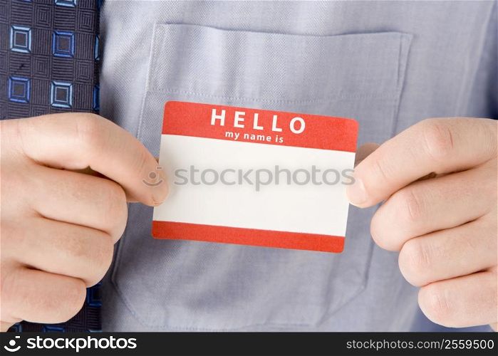 Close Up Of Businessman Attaching Name Tag
