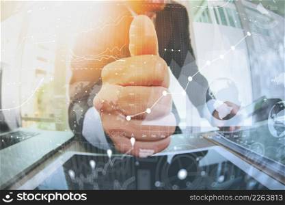close up of businessman giving thumbs up with business strategy diagram in his office as concept