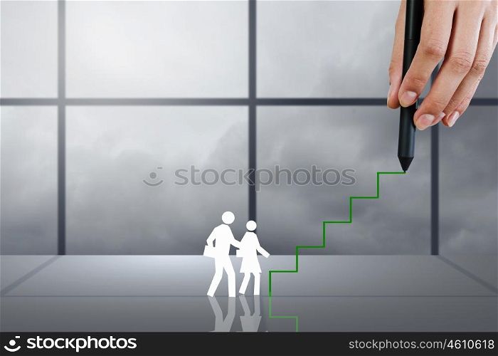 Close up of businessman hand drawing career ladder. Training and promotion