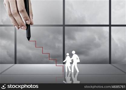 Close up of businessman hand drawing career ladder. Training and promotion