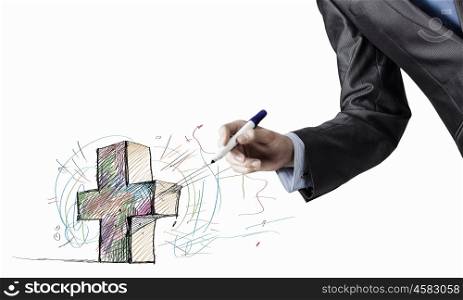 Close up of businessman hand drawing cross. Draw your purpose