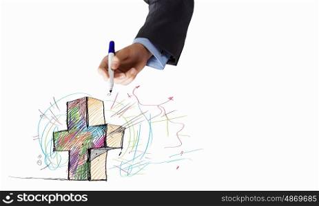 Close up of businessman hand drawing cross. Draw your purpose