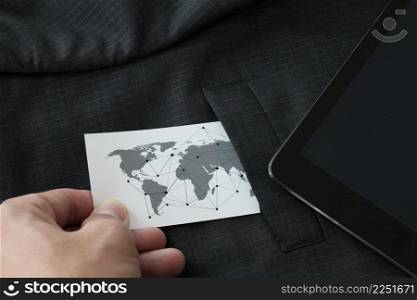close up of businessman hand picking business card with social media diagram concept from the pocket of gray suit jacket background