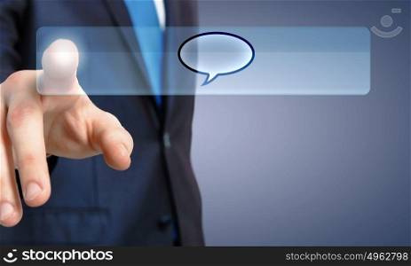 Close up of businessman hand pushing chat icon. Chat icon