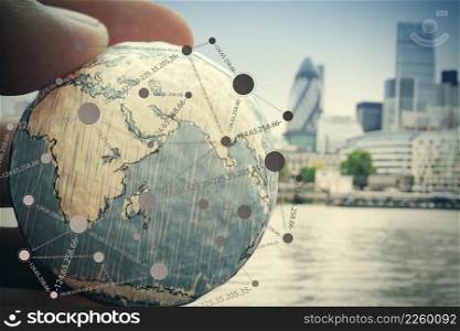 close up of businessman hand showing texture the world with digital social media network diagram concept Elements of this image furnished by NASA london city background