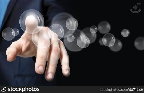 Close up of businessman hand touching icon on screen. Finger touching icon