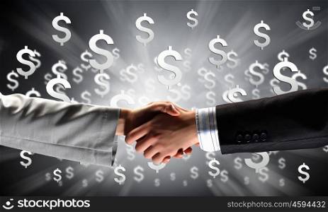 Close up of businessman hands making deal. Business handshake