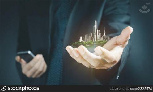 Close up of businessman holding city model in hands