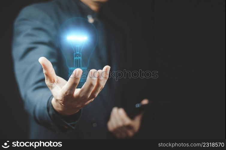 Close up of businessman holding digital image of brain.