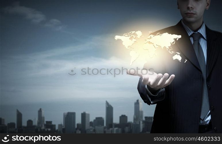 Close up of businessman presenting world map in palm. Global interaction