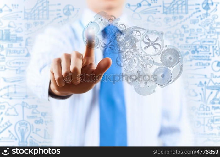 Close up of businessman pushing gear icon on media screen. Businessman activating gears mechanism