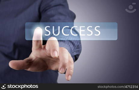 Close up of businessman pushing success icon on media screen. Success icon