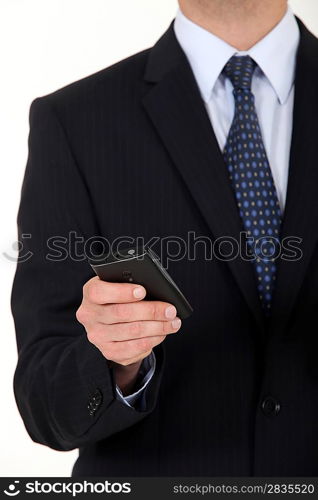 Close-up of businessman sending text