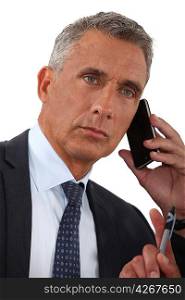 close-up of businessman talking on his cell