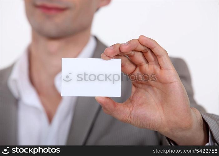 Close-up of businessman with card