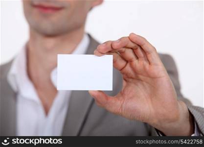 Close-up of businessman with card