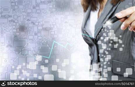 Close up of businesswoman drawing increasing graph with marker. Plan of my success