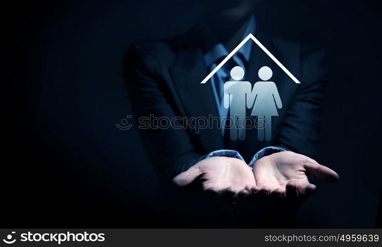 Close up of businesswoman hands holding digital icon in palm. Real estate question