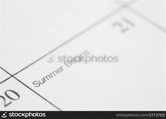 Close up of calendar displaying the beginning of summer.
