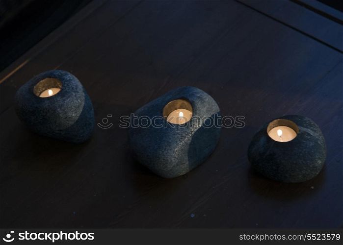 Close-up of candles in stones, Kenora, Lake of The Woods, Ontario, Canada