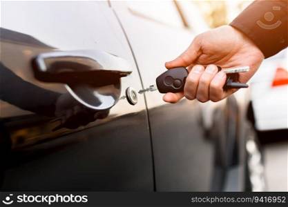 Close-up of car keys. The driver opens and closes the auto. In the residential area of the city.. Close-up of car keys. The driver opens and closes the auto. In the residential area of the city