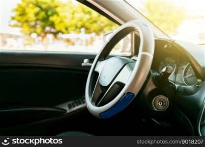 Close up of car steering wheel. Side view of a car steering wheel. A car wheel with copy space.