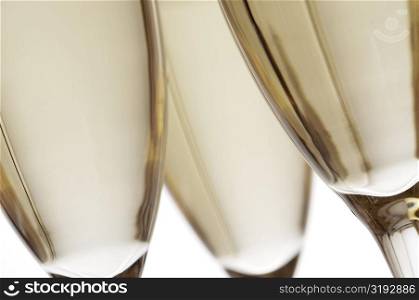 Close-up of champagne in three champagne flutes