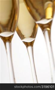 Close-up of champagne in three champagne flutes