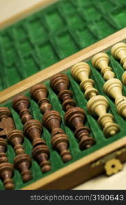 Close-up of chess pieces in a wooden box