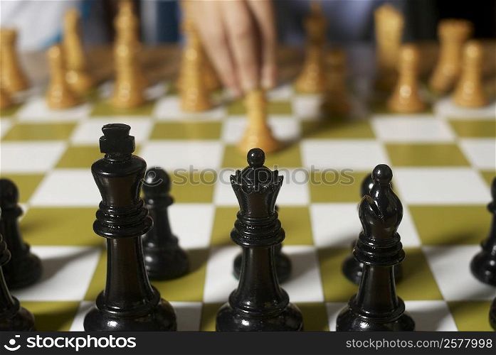 Close-up of chess pieces on a chessboard