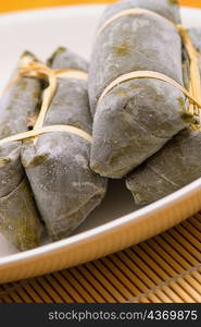 Close-up of Chinese dumplings wrapped in bamboo leaves