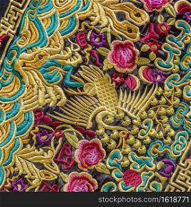 Close up of Chinese embroidery. This is an ex&le of the craftsmanship of the Chinese for this embroidery. Everything is made by hand and a lot of gold color is used.