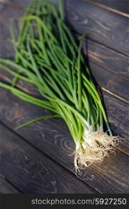 Close up of chives on wooden table