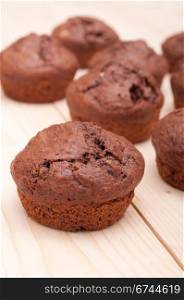 Close Up of Chocolate Muffins on Wooden Table