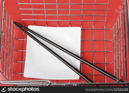 Close-up of chopsticks in a basket
