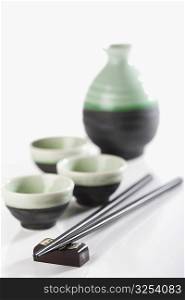 Close-up of chopsticks with bowls