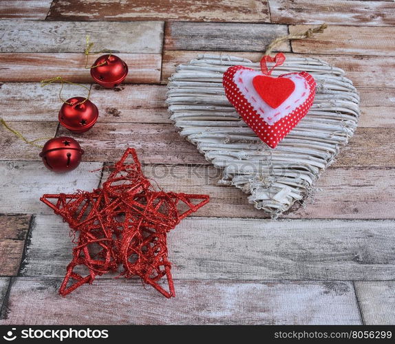 Close-up of Christmas decoration on wooden surface - star, heart and balls.