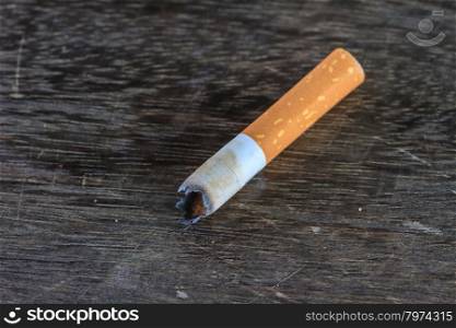 close up of Cigarettes butt on wooden