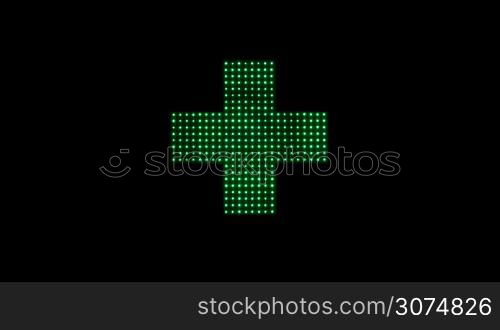 Close up of classical Pharmacy led light cross in green