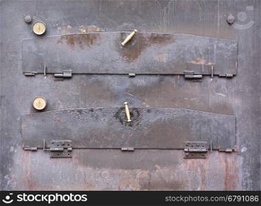 Close-up of closed aged iron pizza oven