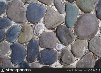 Close up of cobblestones background. High resolution texture