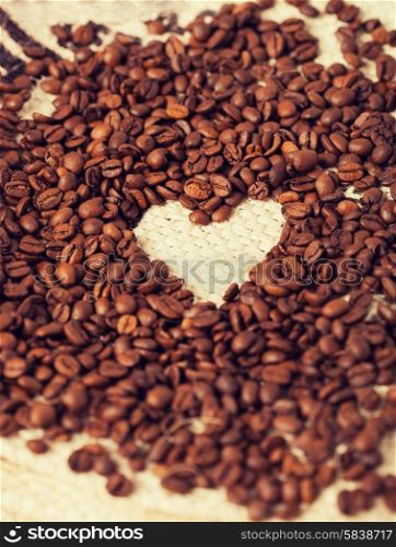 close up of coffee beans on the textile background