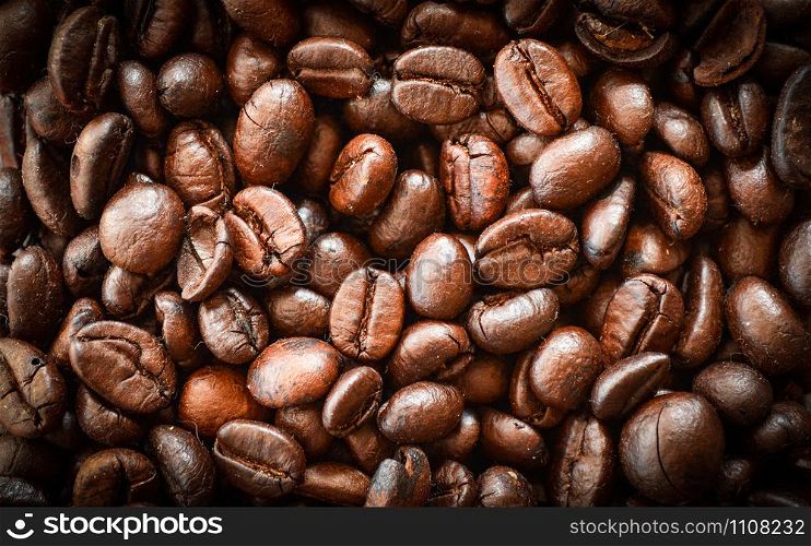 Close up of Coffee beans roasted texture background - top view