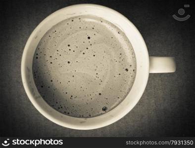 close up of coffee cup on white background