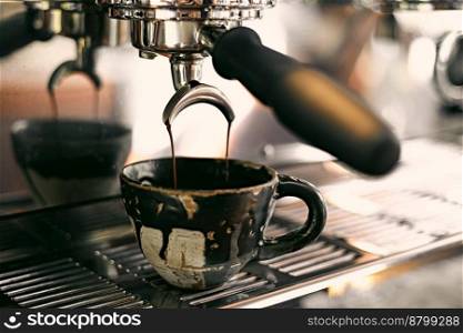 Close up of coffee machine pouring espresso in cafe, selective focus . Close up of coffee machine pouring espresso in cafe,