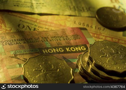 Close-up of coins on paper currency