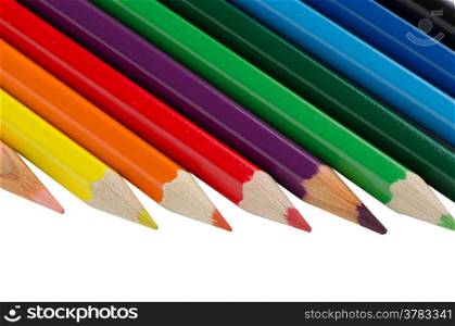 Close up of color pencils with different color over white background