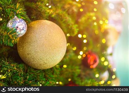Close up of Colorful balls on Green Christmas tree background Decoration During Christmas and New Year.