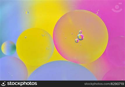 Close up of colorful bubbles on colored background
