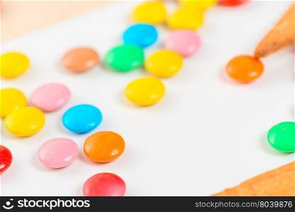 close-up of colorful candies jelly beans on white table